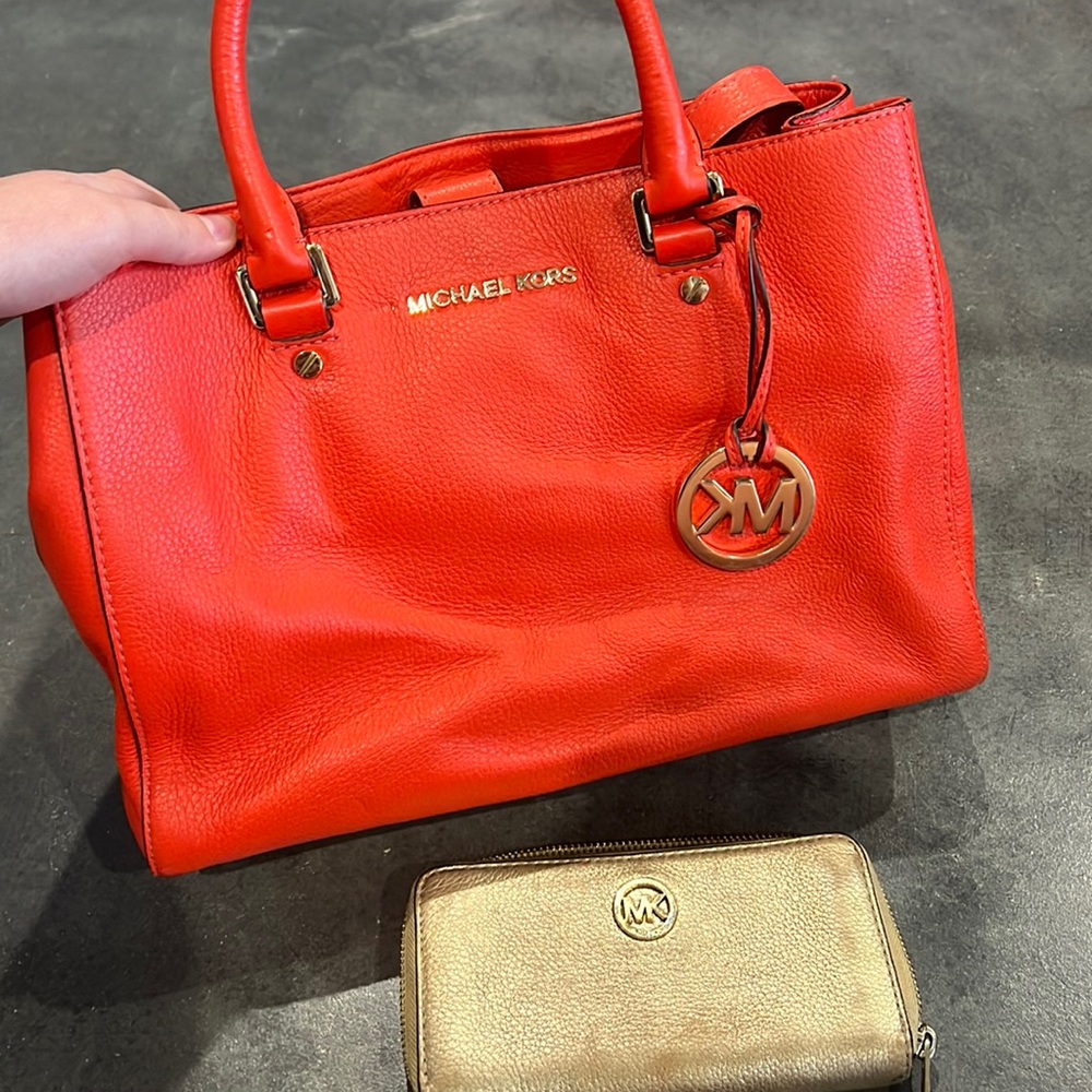 Orange and gold gently used Michael Kors bag and wallet!